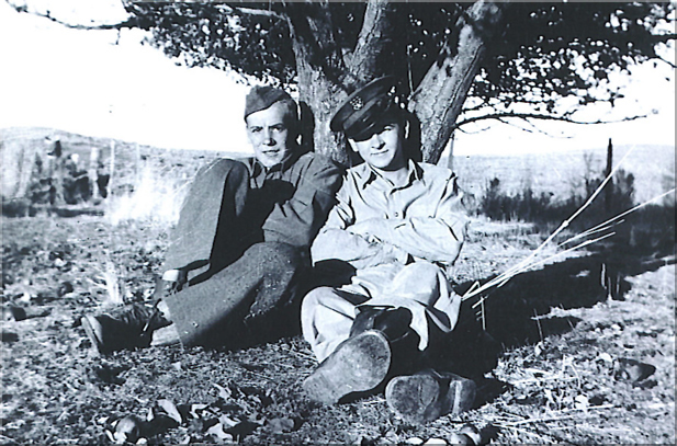 Stanley S. Jamraz with a friend sitting at a tree